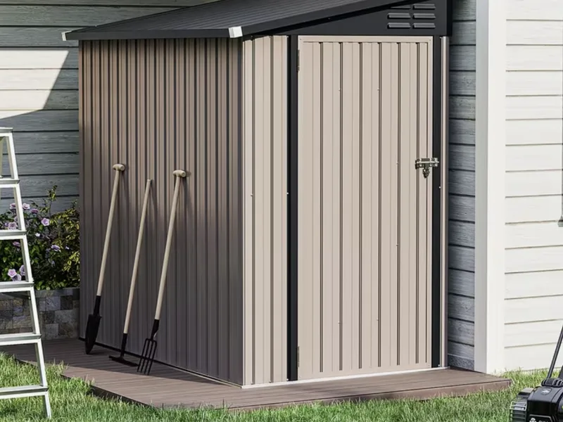 Lean-to 6x4 ft metal shed standing against a house wall.